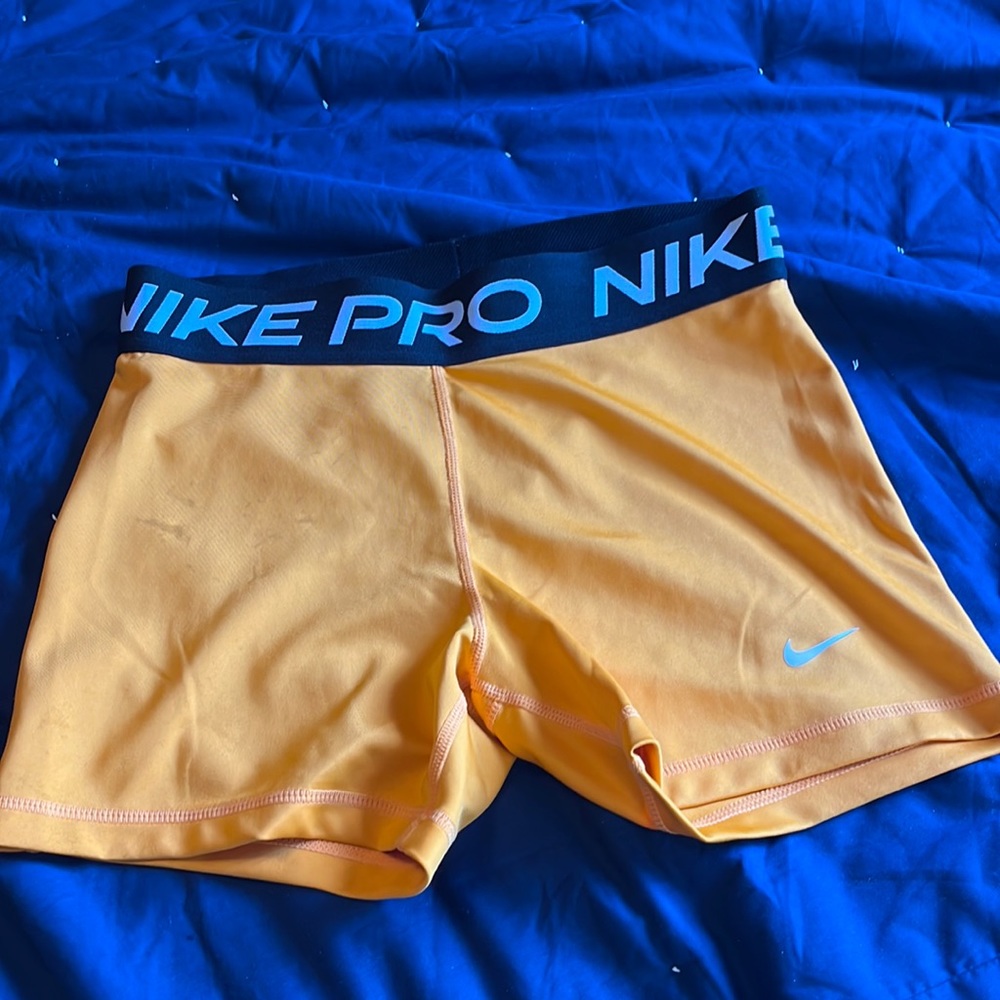 Orange Nike pros